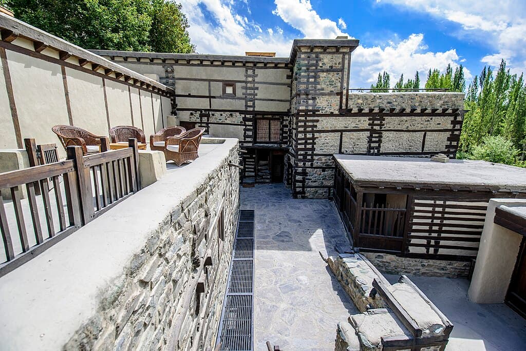 Shigar Fort Palace Baltistan carved wooden balconies stone courtyard